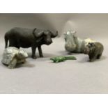 A group of five carved animals in soapstone, green hard stone and wood, water buffalo,