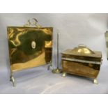 An Edwardian brass coal box with semi domed cover, leaf strapwork handle and ring handles to the