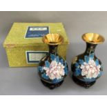 A pair of 20th century Chinese cloisonné vases of baluster form enamelled with peonies and song