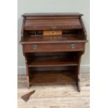 A small oak tambour fronted bureau with drawer across above two open shelves, 76cm wide x 98cm
