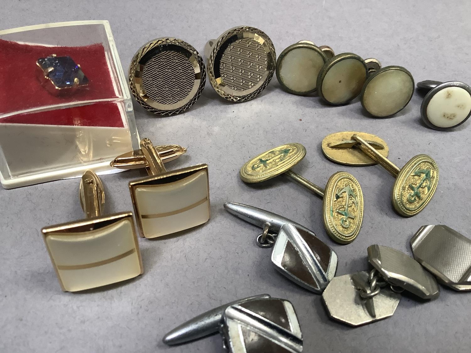 A collection of mid to late 20th century cufflinks and collar and tie tacks