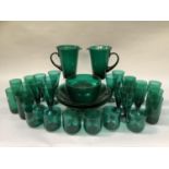 A suite of Hortensja, Poland, emerald table glass comprising two large water jugs 20.5cm high, six