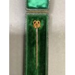 An Edward VII stick pin, the knot head in 15ct gold on 9ct pin in original fitted box