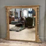 A Victorian gilt overmantel mirror rectangular having egg and dart and bead moulding and
