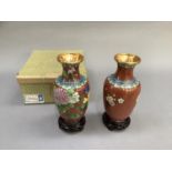 A pair of 20th century Chinese cloisonné vases of ovoid shape, enamelled with peony and song bird