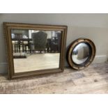 A gilt convex mirror with black reeded slip, 48.5cm, together with a rectangular gilt framed wall