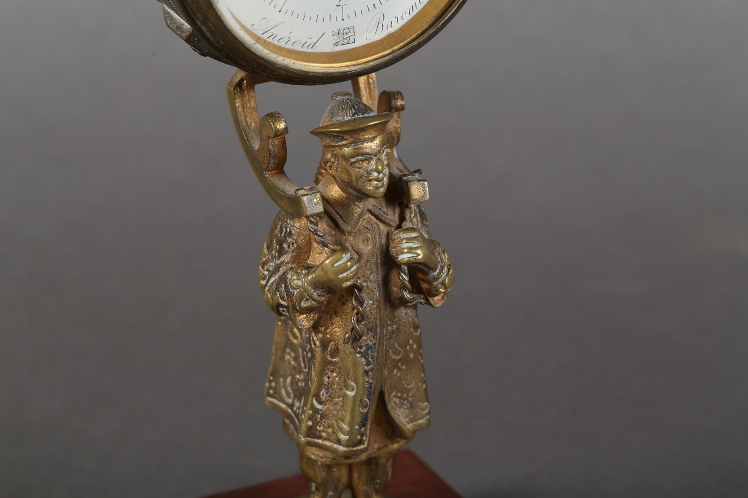 A late 19th century gilt-brass desk barometer, the drum casing held aloft by the figure of a China - Image 10 of 12