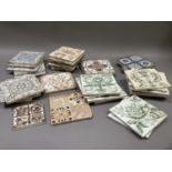 A quantity of Victorian patterned tiles in various designs including, blue on cream, green on cream,