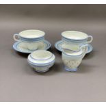 A 1930s Royal Doulton tea for two set comprising two cups and saucers, milk jug and sugar bowl,
