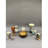 A collection of mid 20th century pottery and glass vases including carnival glass, silver resist,