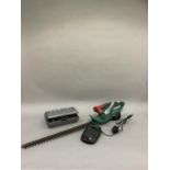 A Bosch battery powered hedge trimmer with charger together with a Dremel hand power tool with
