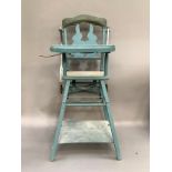 A mid 20th century child's high chair in blue