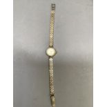A Certina lady's wristwatch c.1960 in 9ct gold case no. 0839001233953 on an integral engraved