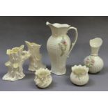 Six pieces of Belleek ware, various dates, comprising pair of tree trunk vases, jug and vase, flower