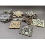 A quantity of Victorian patterned tiles variously printed in grey and amber and black, green on