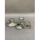 Two silver inkwells, one of silver lidded glass square section, Birmingham 1938, a Capstan style