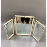 A set of cream and floral decorated triple toilet mirrors