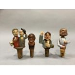 Four carved wood and painted novelty bottle stoppers modelled as busts of an old lady, lady in