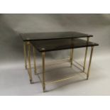A nest of two smoked glass and gilt metal coffee tables, largest 59cm x 32cm