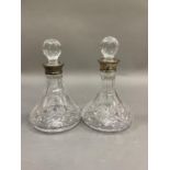 A pair of Mappin & Webb silver collared cut glass decanters, Birmingham 1994, 18cm high