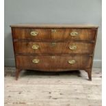 A 19th century figured mahogany chest of three drawers with oval back brass plates and swing handles