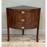 An early 19th century mahogany corner wash stand, the bow front with a dummy drawer above a single