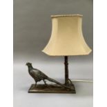 A cold painted metal pheasant and tree on a naturalistic base of rectangular outline, as a lamp,