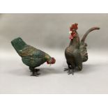 A cold painted metal cockerel and hen, 29cm high