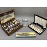 A walnut canteen of silver plated cutlery for six, a boxed three piece carving set to match the