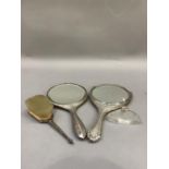 Two silver backed hand mirrors, silver backed hairbrush and a silver collared glass scent bottle (no