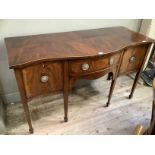 A mahogany crossbanded serpentine fronted sideboard with boxwood stringing having a drawer to the
