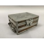 A Chinese hardwood and pewter casket, c.1930s, modelled as a strong box, the cover incised with a