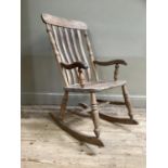A pine rail back rocking chair