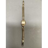 A Tell lady's wristwatch c.1950 in 18ct gold square case with single scalloped leg no. 113534 with