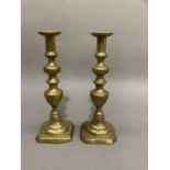 Pair of Victorian brass candlesticks, baluster columns on domed and square canted bases, 34cm high
