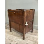 A George III mahogany night cabinet having a wavy gallery above a drawer to the side the front