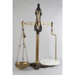 A SET OF VICTORIAN BRASS AND CAST IRON SHOP SCALES, 84cm high