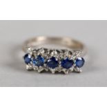 A SAPPHIRE AND DIAMOND CLUSTER RING in 18ct white gold, the circular faceted sapphire claws set