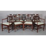 A GEORGE IV SET OF EIGHT MAHOGANY DINING CHAIRS each having a moulded top bar rail above fanned