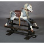AN EARLY 20TH CENTURY DAPPLED GREY ROCKING HORSE, real hair mane and tail, later brown leather '