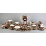 A ROYAL CROWN DERBY COFFEE SERVICE, pattern 1128, comprising coffee pot 23cm high, 12 cups and 12