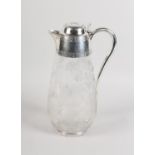 A VICTORIAN SILVER MOUNTED GLASS CLARET JUG BY EPHRAIM TYSALL, London 1887, the ovoid body etched