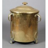 AN ART NOUVEAU BRASS COAL BOX AND COVER, cylindrical, three strapwork handles and paw feet, with tin