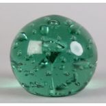 A 19TH CENTURY GREEN GLASS DUMP of spherical outline the mushroom centre within a surround of