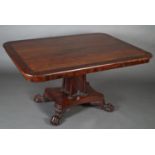 A REGENCY MAHOGANY AND CROSSBANDED BREAKFAST TABLE inlaid with brass stringing, rounded
