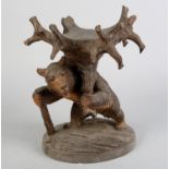 A LATE 19TH CENTURY BAVARIAN CARVED WOODEN BEAR, with black glass bead eyes, walking on hind legs, a