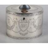 A GEORGE III SILVER TEA CADDY BY HENRY CHAWNER, London 1788, of oval outline,