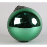 A GREEN MIRRORED GLASS WITCH'S BALL, with metal hanging pendant, approximate 18cm diameter