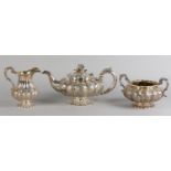 A WILLIAM IV SILVER THREE PIECE TEA SERVICE, MAKER ROBERT HENNELL, London 1834 of compressed