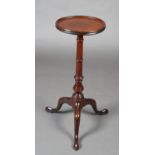 A MID 18TH CENTURY MAHOGANY WINE TABLE, dished circular top on a ring turned column and on three